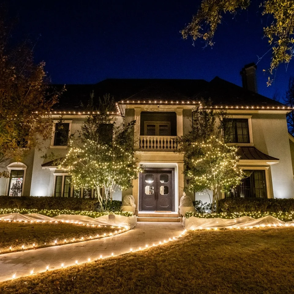 Warm white Christmas light installation outlining a Corpus Christi-area home