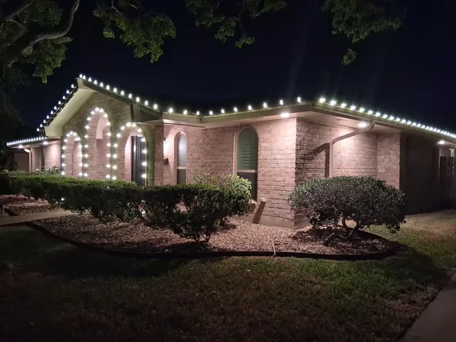 Warm white Christmas lights professionally installed on a Corpus Christi home